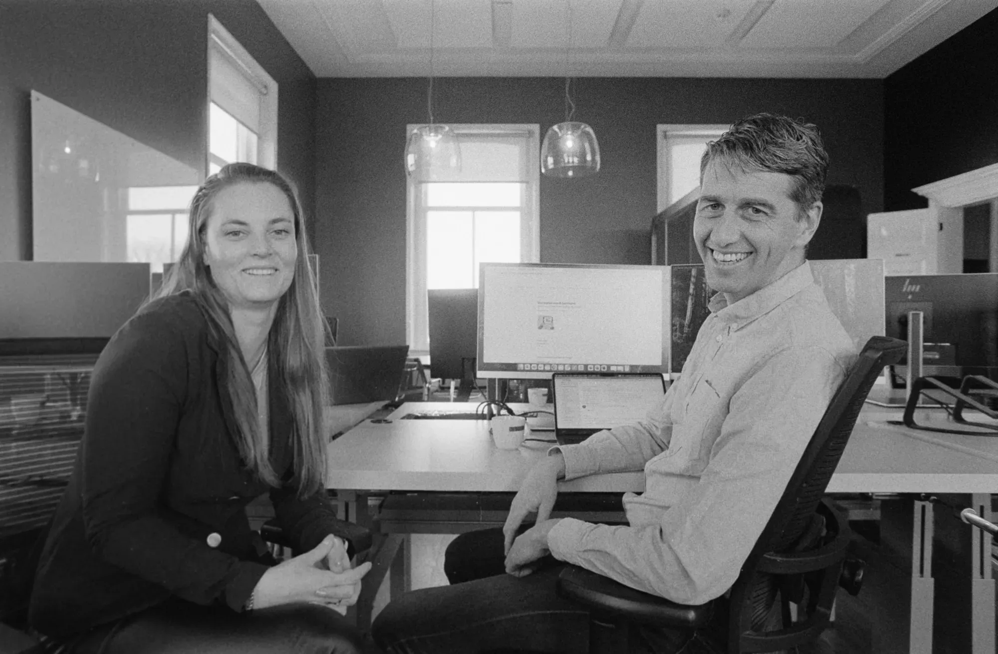 Colleagues smiling at camera
