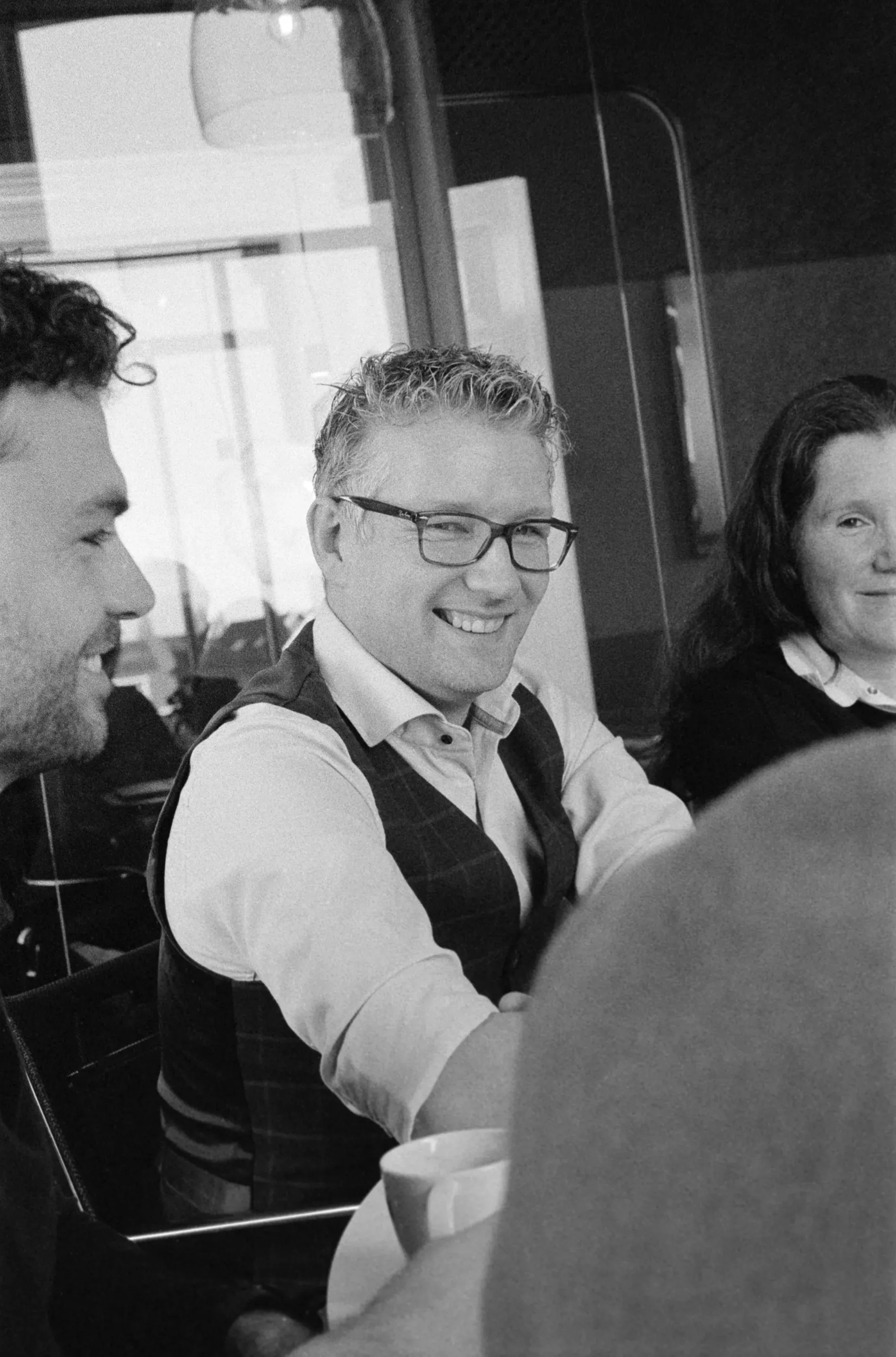 Colleagues in meeting, smiling