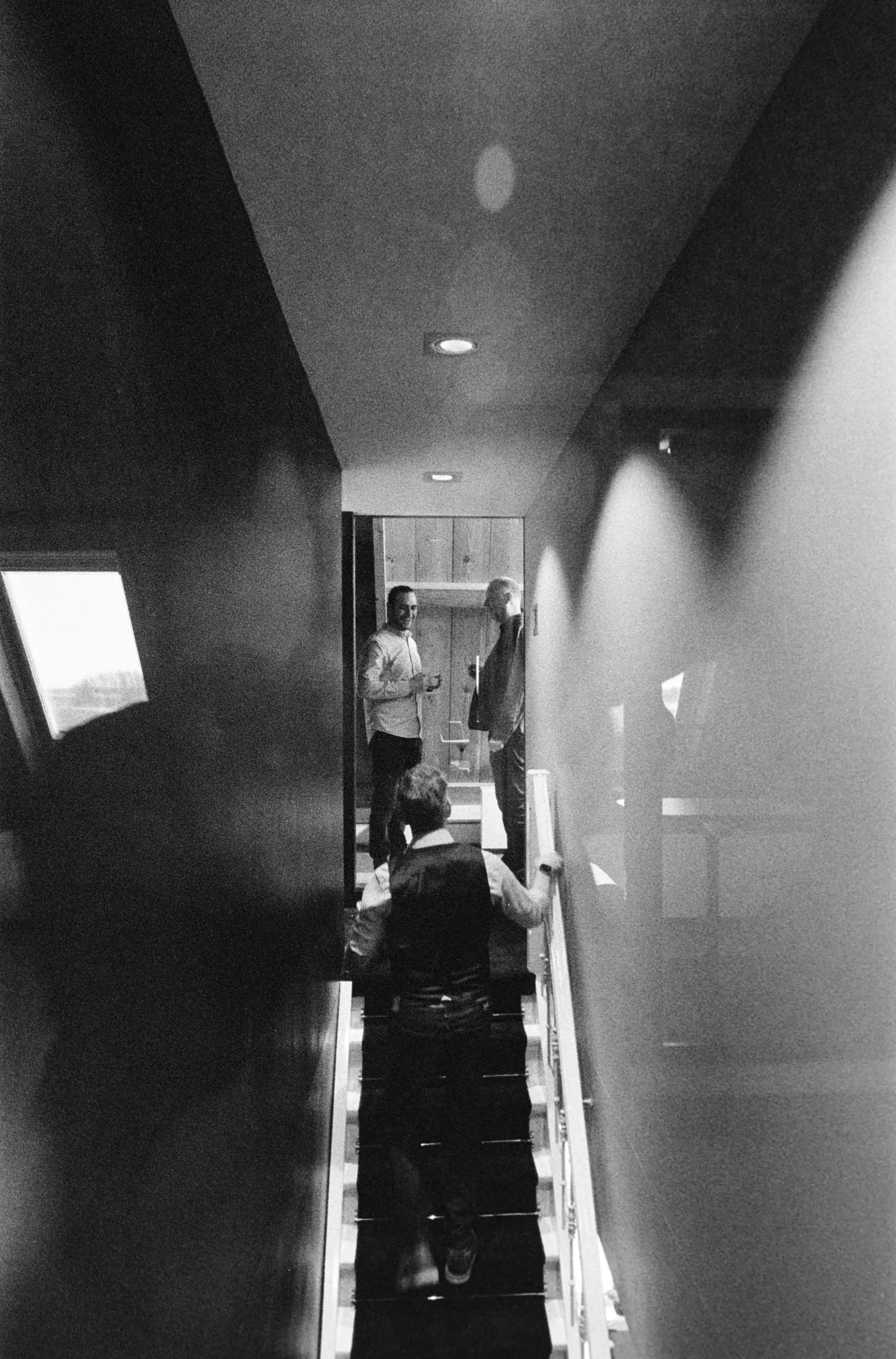 Three colleagues chatting on the stairs