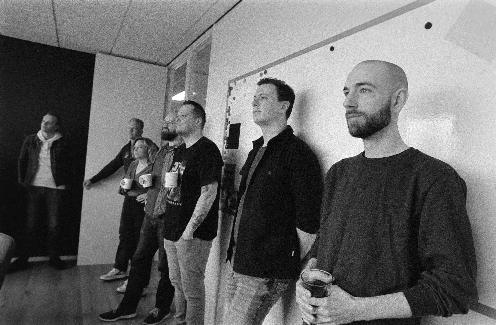 Seven colleagues listening attentively